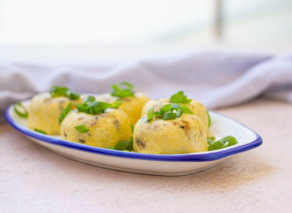 Set of 5 Instant Pot egg bites on a flat plate.