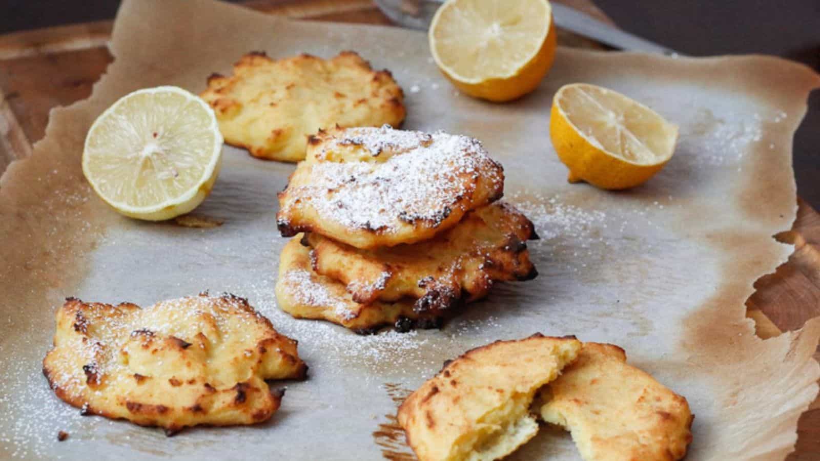 Pancakes on a parchment paper on cutting board.