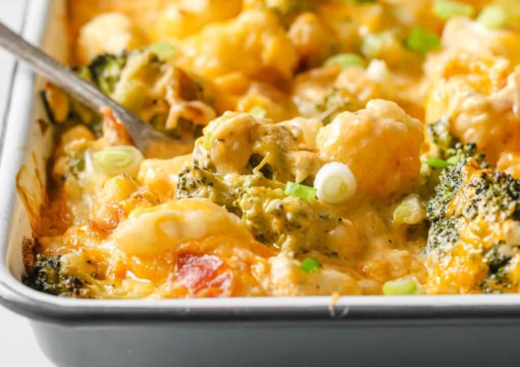 A casserole dish filled with broccoli and cheese.