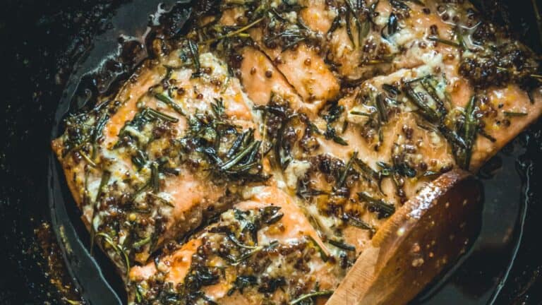 Salmon cooked in a slow cooker with rosemary.