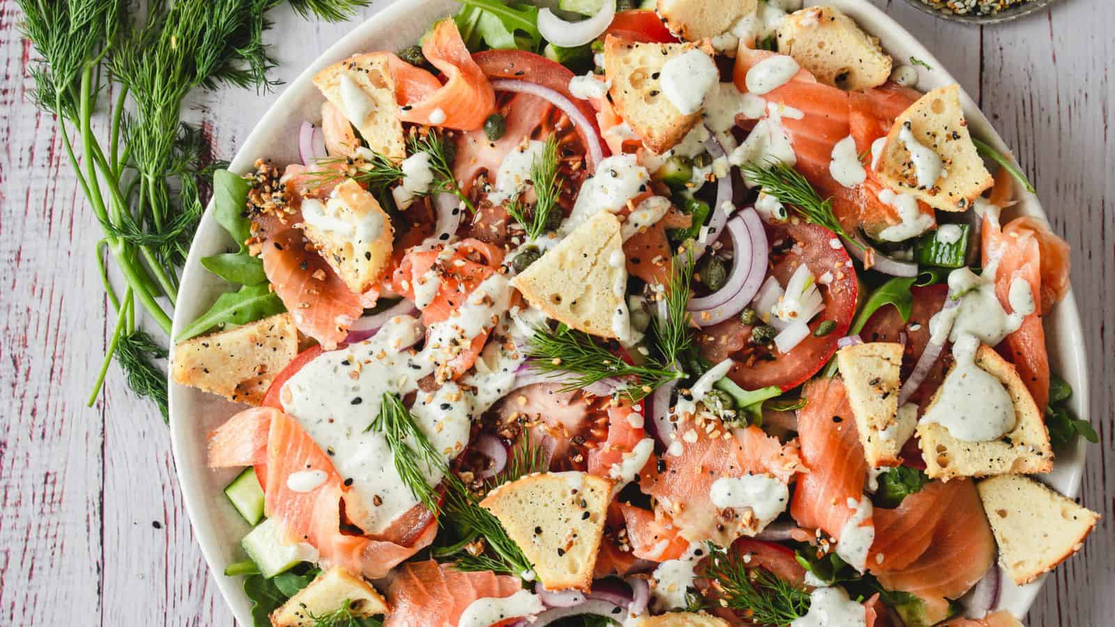 Overhead of smoked salmon and bagel salad.