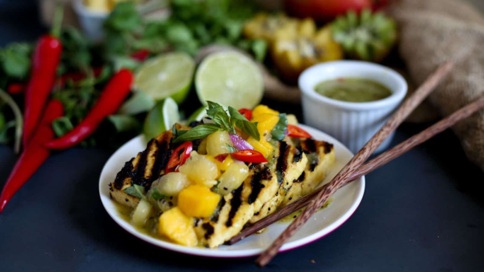 Overhead view of Thai seared tofu with kiwi mango salsa topping.