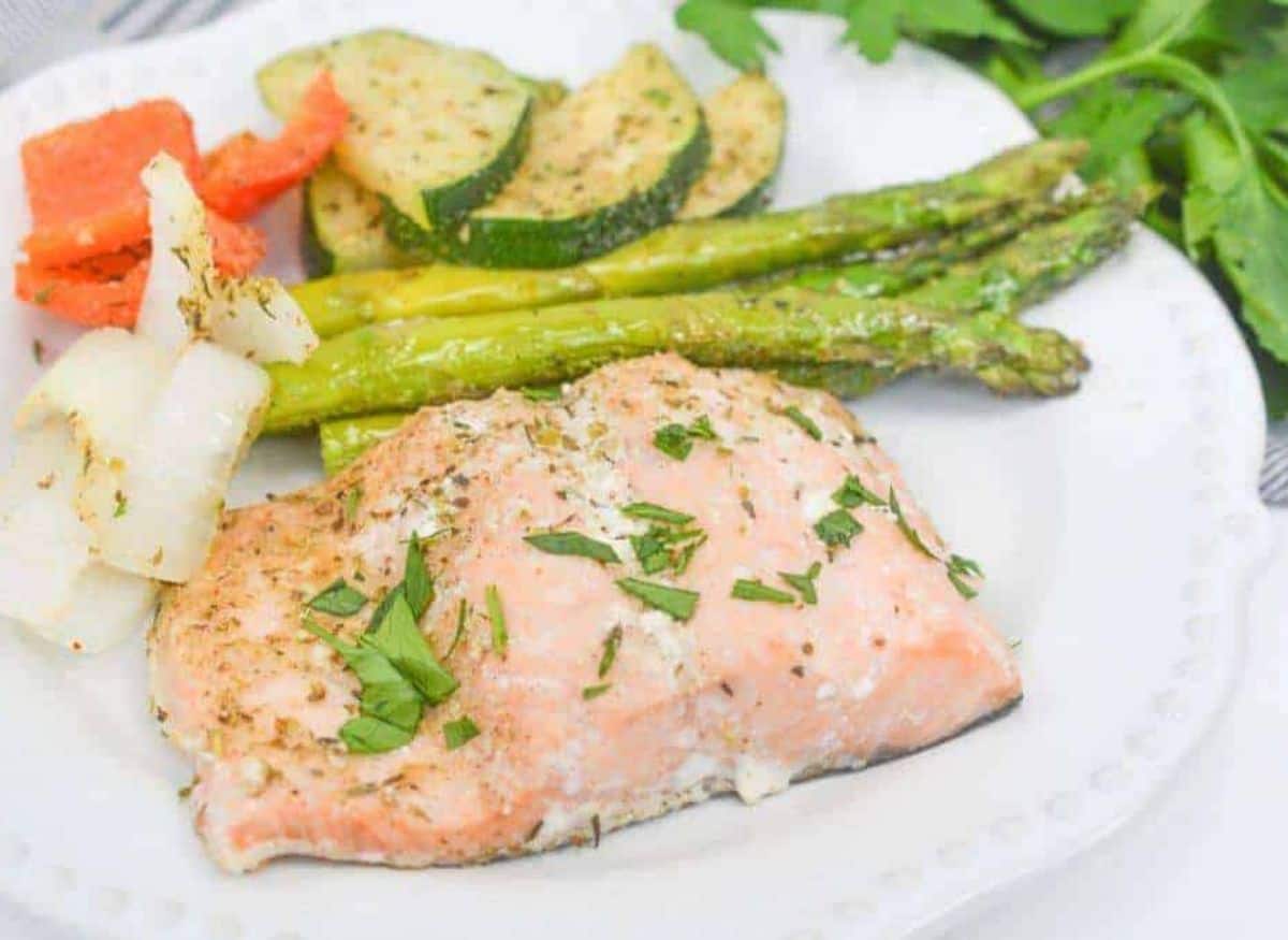 Sheet Pan Salmon and Asparagus on a white plate.