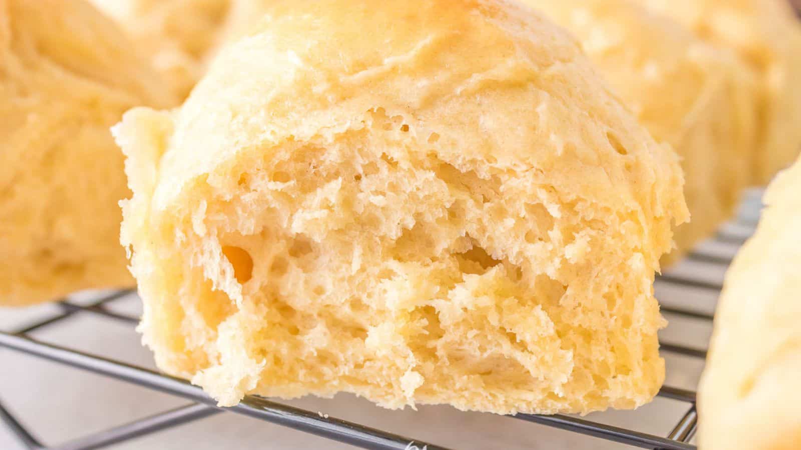 Sourdough Dinner Rolls on a cooling rack.