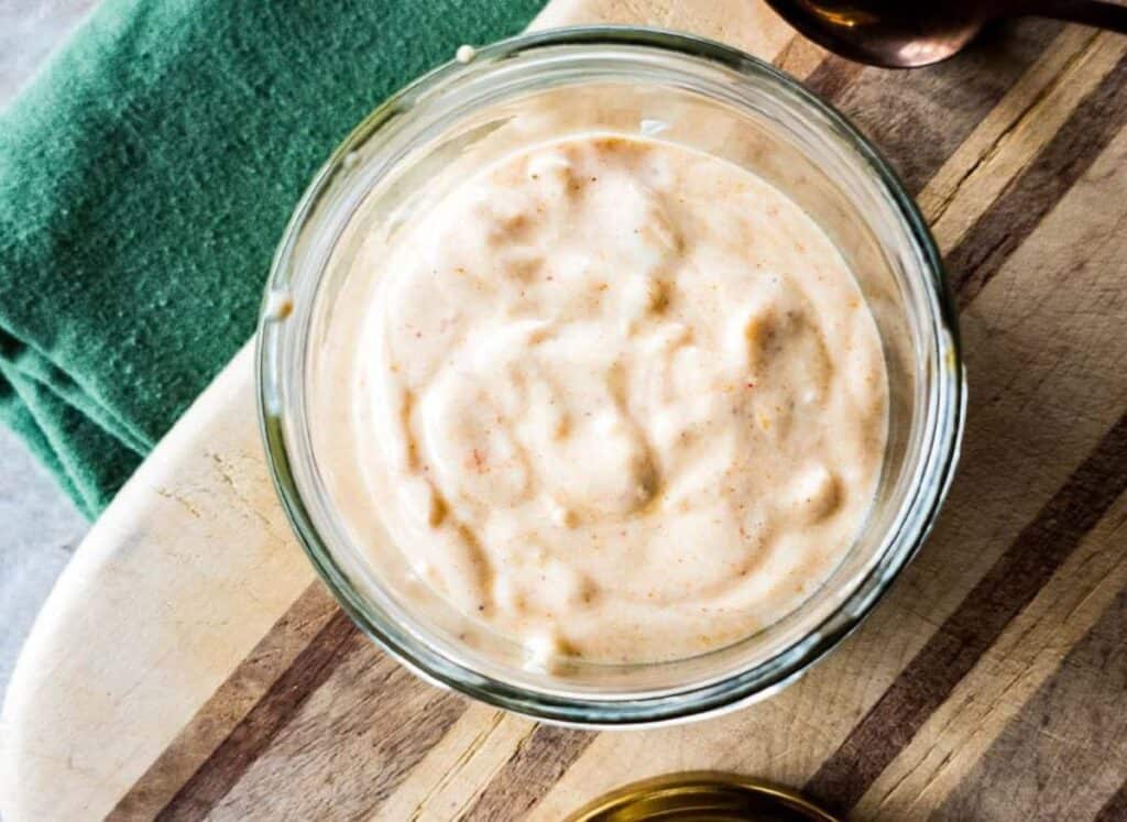 A picture of homemade tiger sauce in bowl on cutting board.