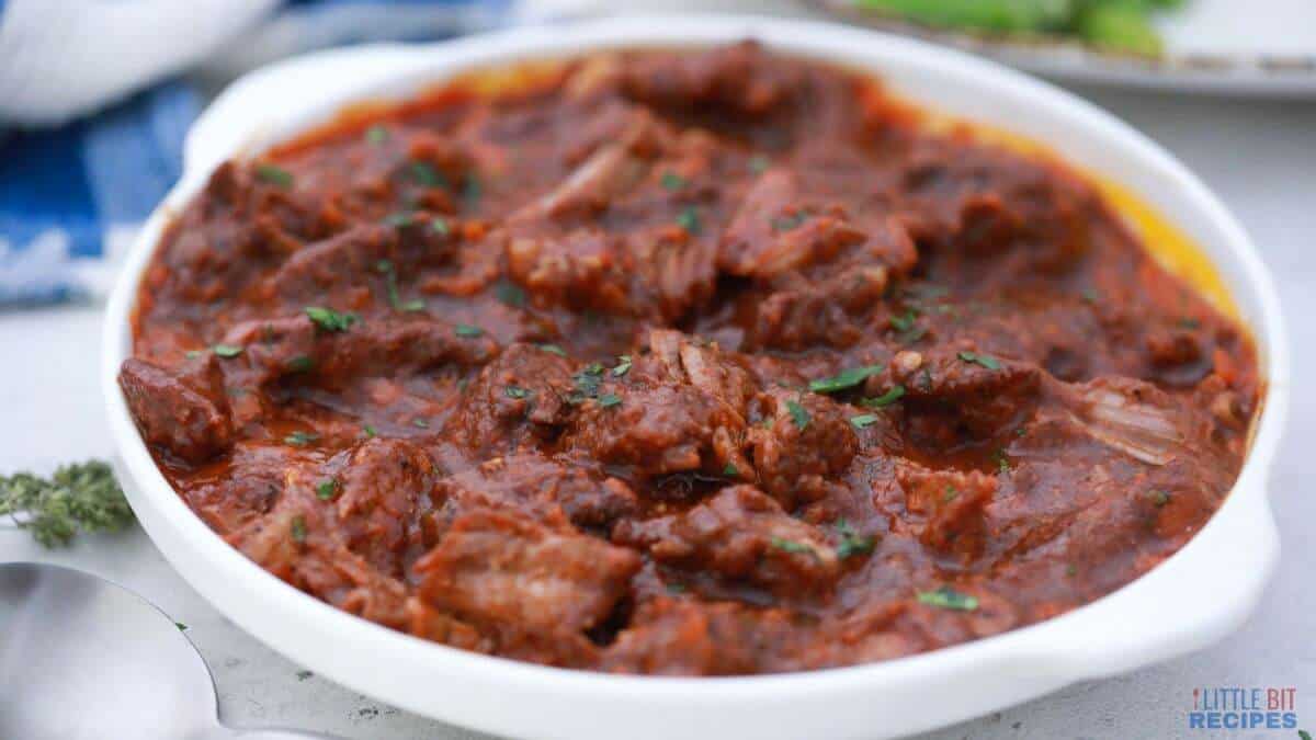 Braised beef short ribs in white bowl.