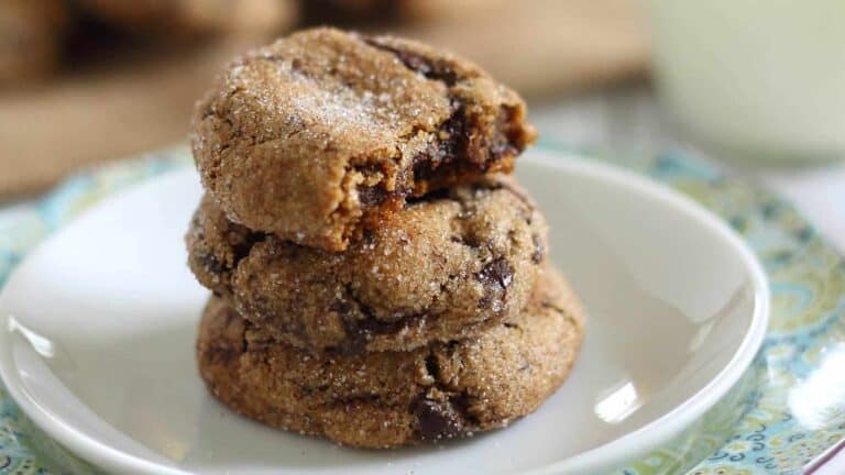 A stack of chocolate chip cookies on a plate.