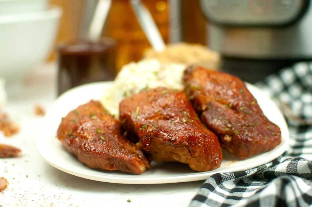 Easy meal - Bbq pulled pork on a plate next to an instant pot.