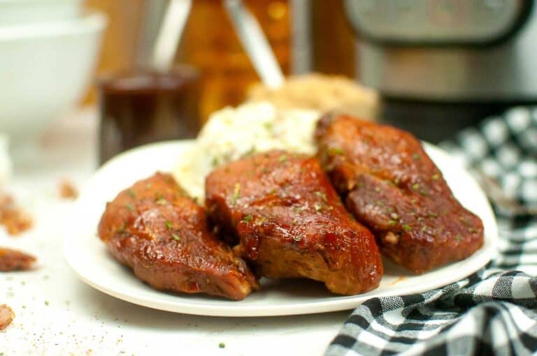 Easy meal - Bbq pulled pork on a plate next to an instant pot.