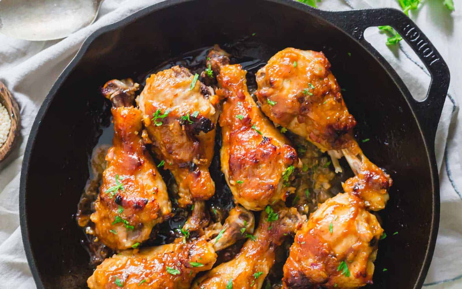 Maple miso chicken in cast iron skillet.