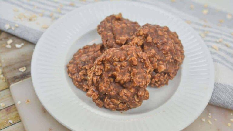 Chocolate oatmeal cookies on a white plate.