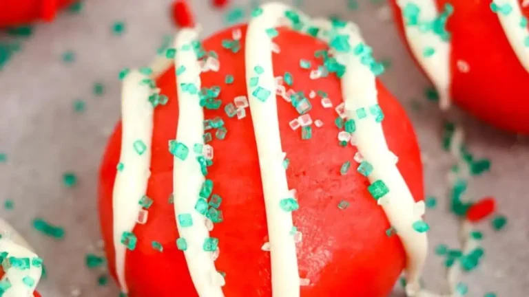 Red velvet Christmas truffles sprinkled with sugar.