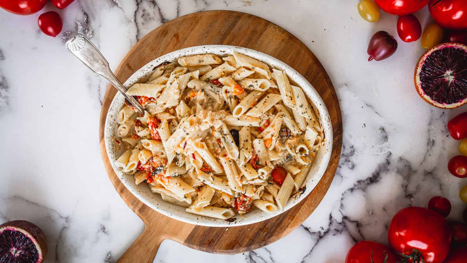 Side view of baked feta pasta on a plate.