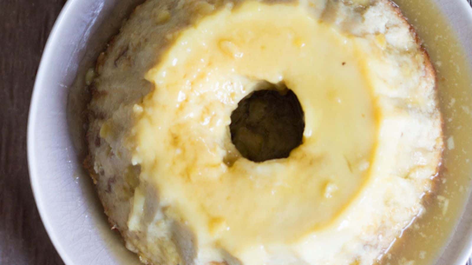 Yellow Argentinian bread pudding on a white plate.