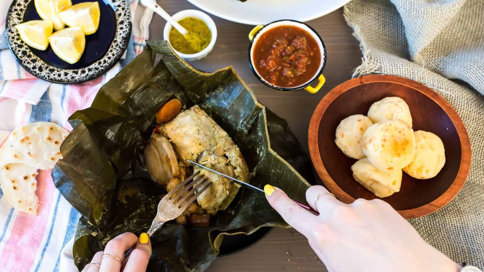 An irresistible plate of easy chicken recipes on a table with a person holding a fork.