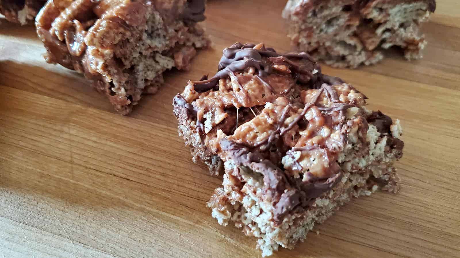 Overhead photo of a pan with double chocolate peppermint cereal bars with one pulled out from the main bunch.