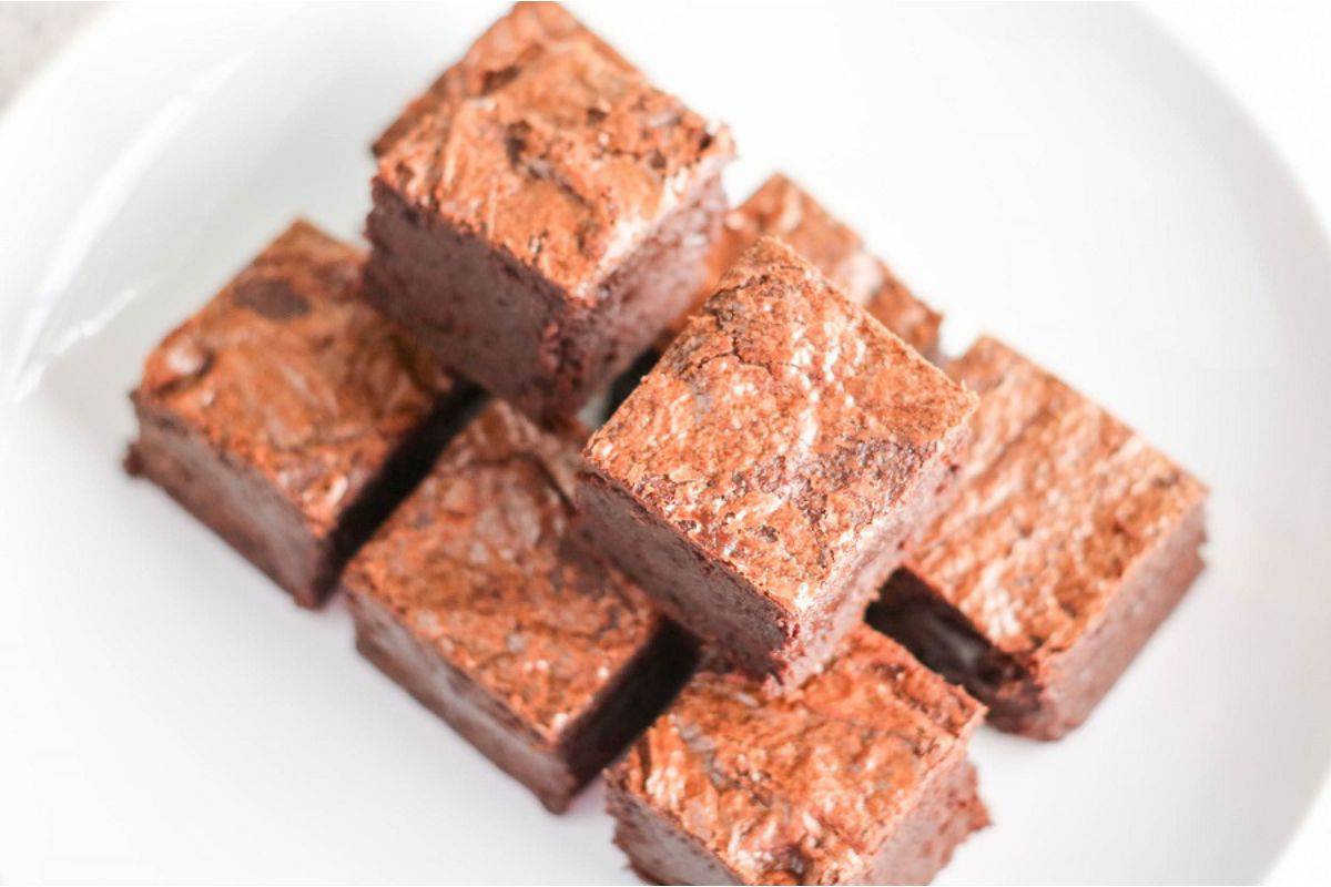 A plate of brownies on a white plate.