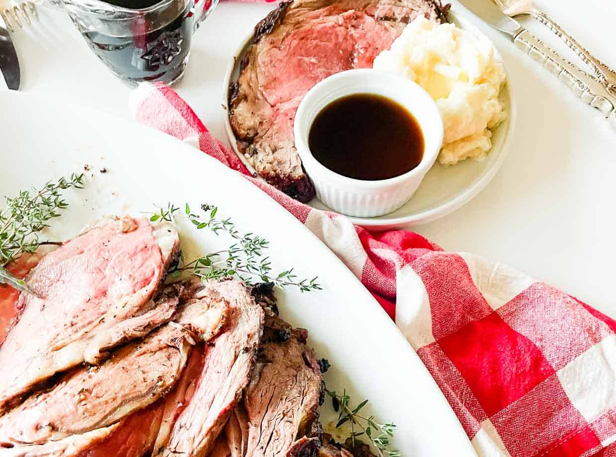 Sliced rib roast on a platter.