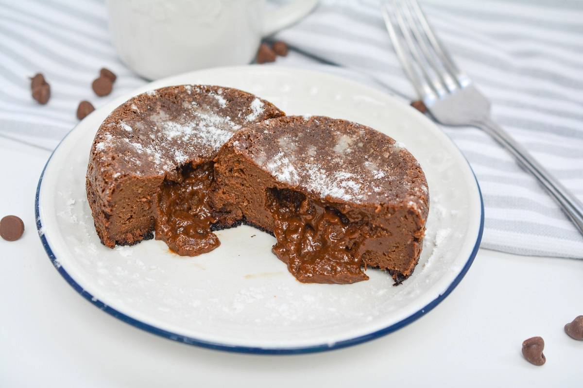 A chocolate cake with a bite taken out of it.