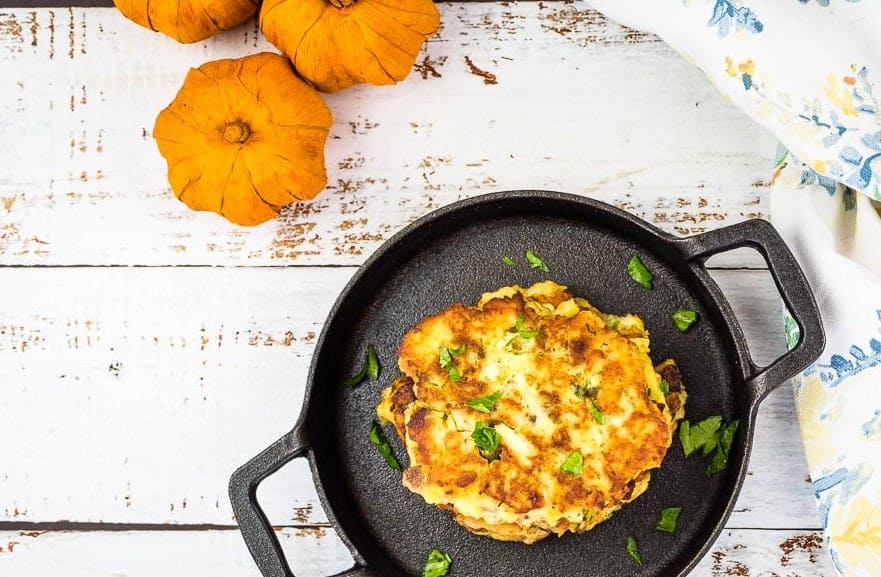 Leftover Turkey Mashed Potato Patties in a skillet on a wooden table.