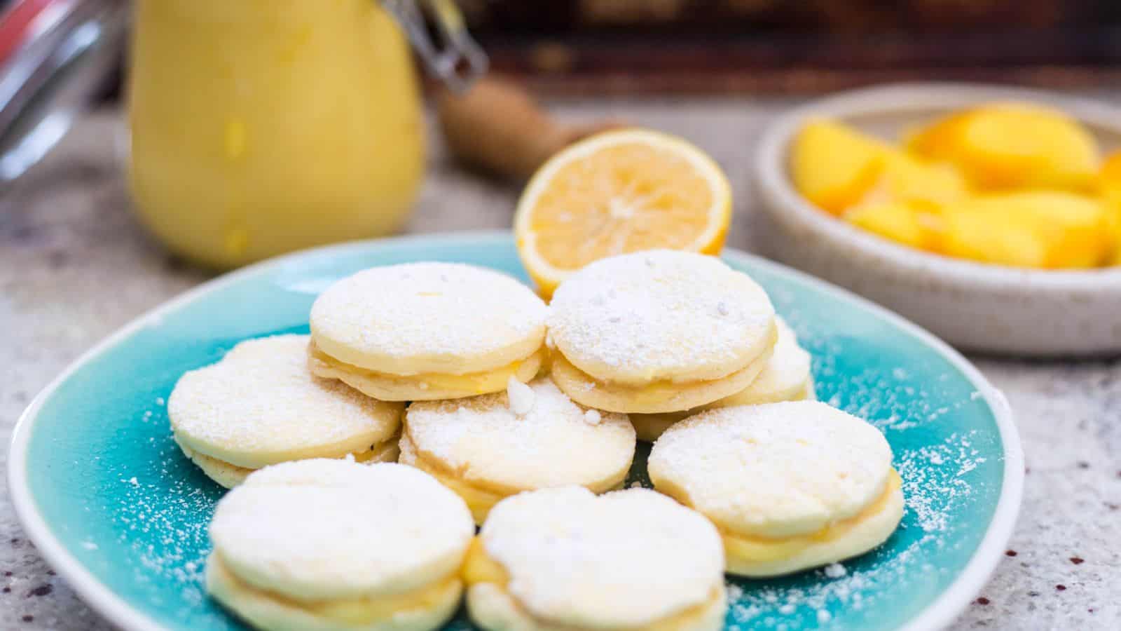 Alfajores on marble plate with coffee.