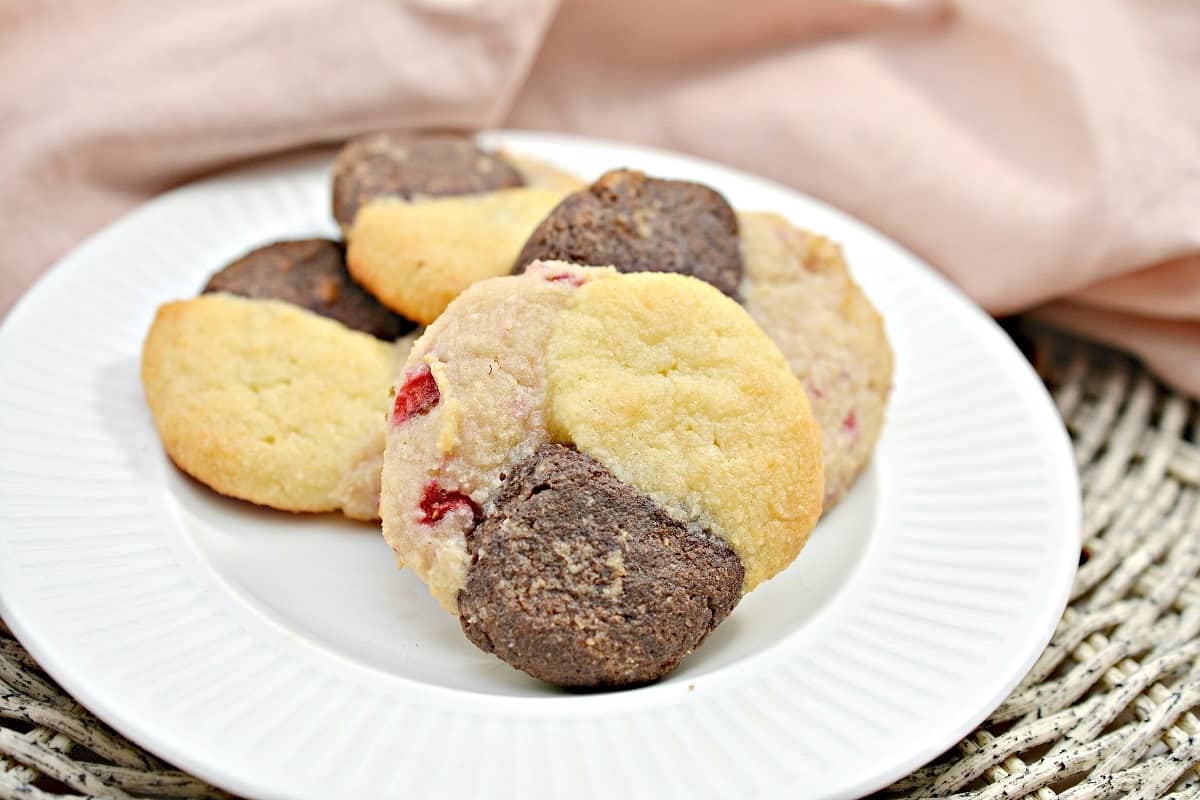 Neapolitan cookies on a white plate.