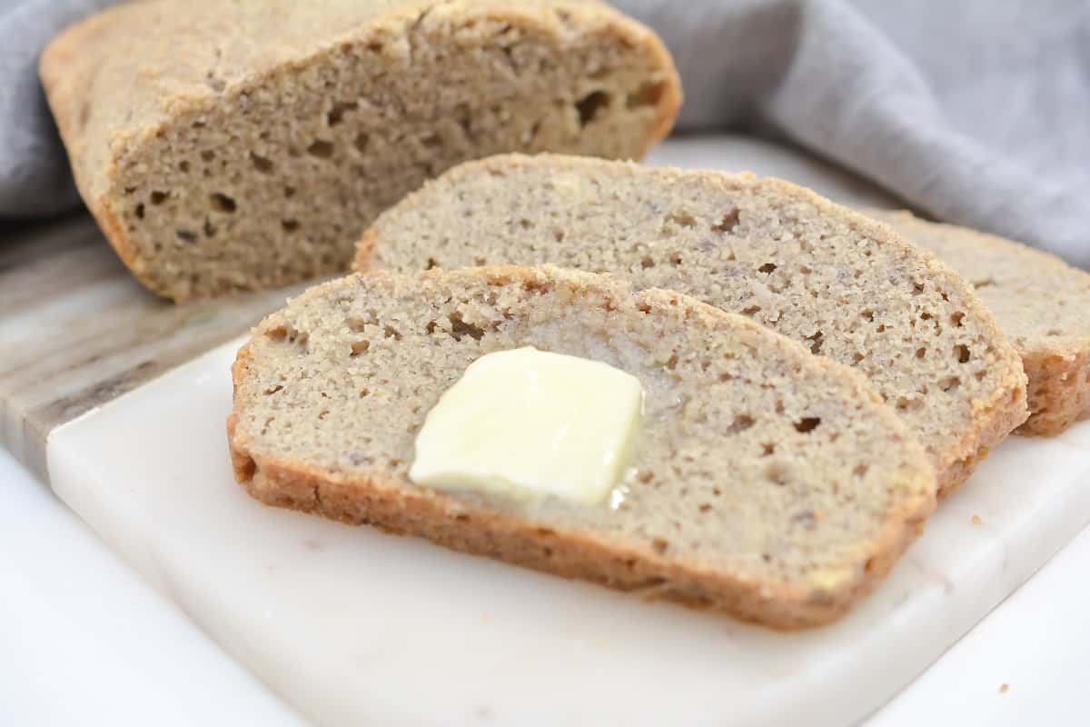 Bread and butter on cutting board.