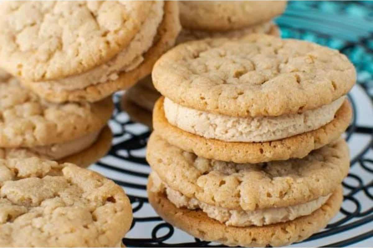 A stack of peanut butter cookies on a plate.