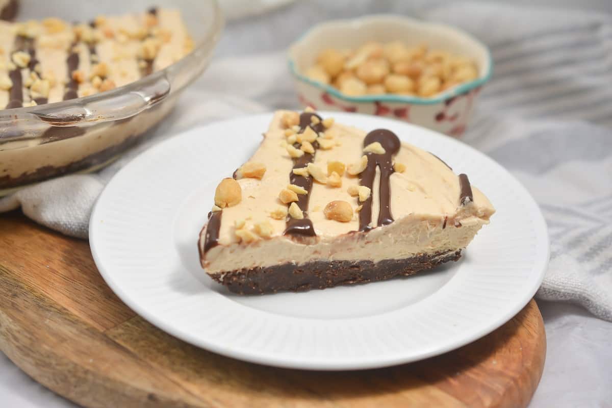 A slice of peanut butter pie on a plate.