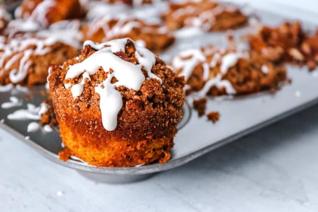 Pecan muffin on a white plate.