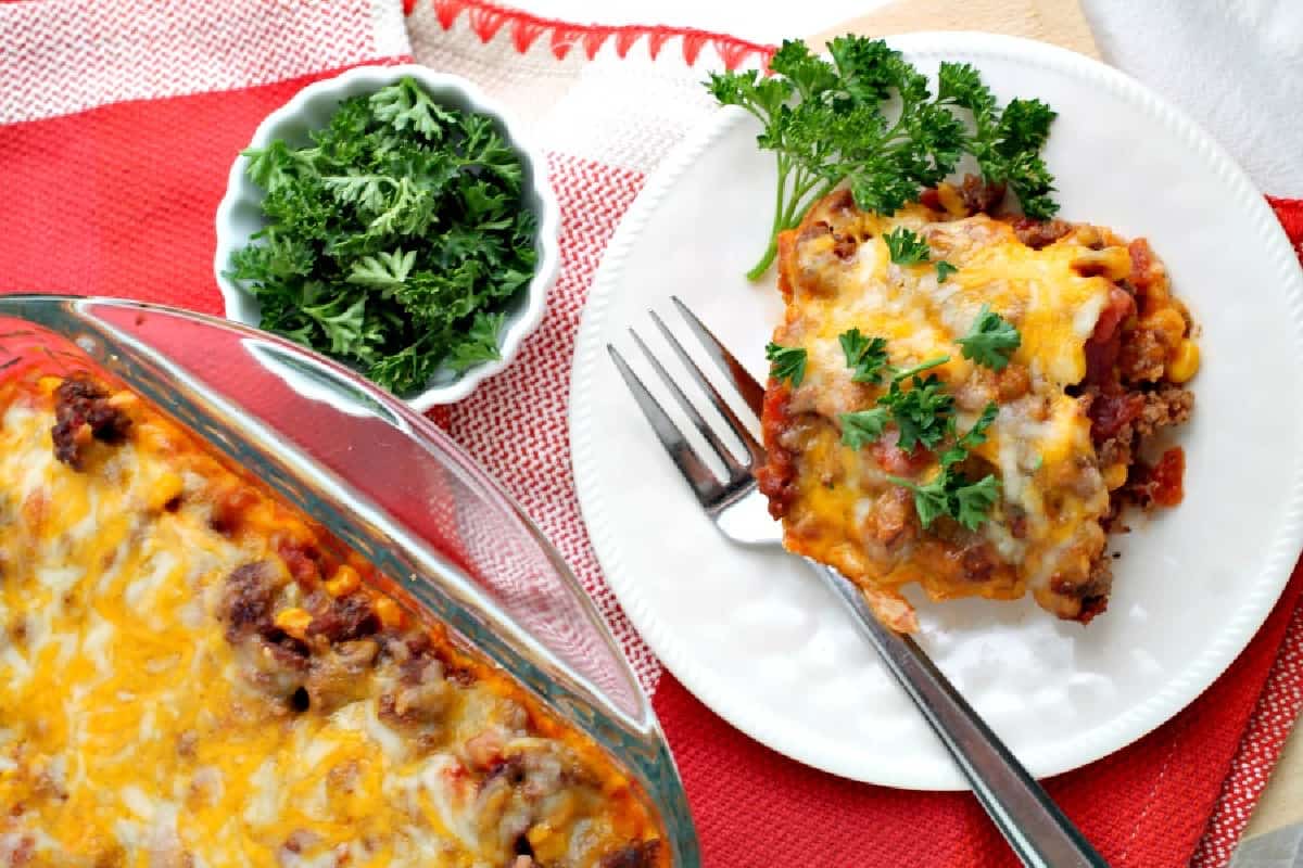 Mexican casserole. on a plate with a fork.