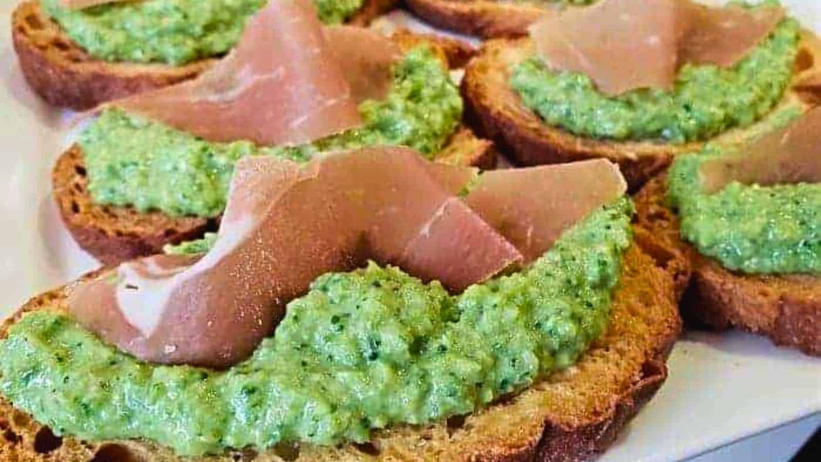 Image shows a white tray with Whipped Vegetable Bruschetta close up.