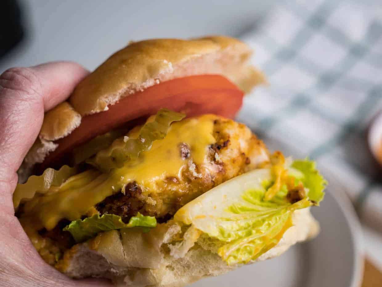 Copycat Chick-fil-A sandwich with tomato, lettuce and cheese.