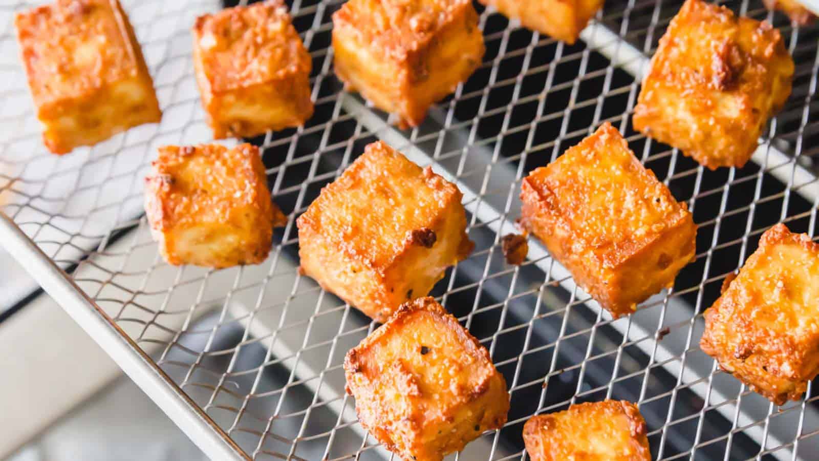 Air fryer tofu on baking rack.