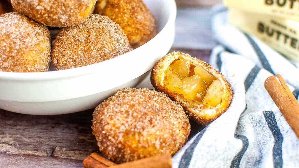 Apple pie bites cut open to show the apple filling inside.