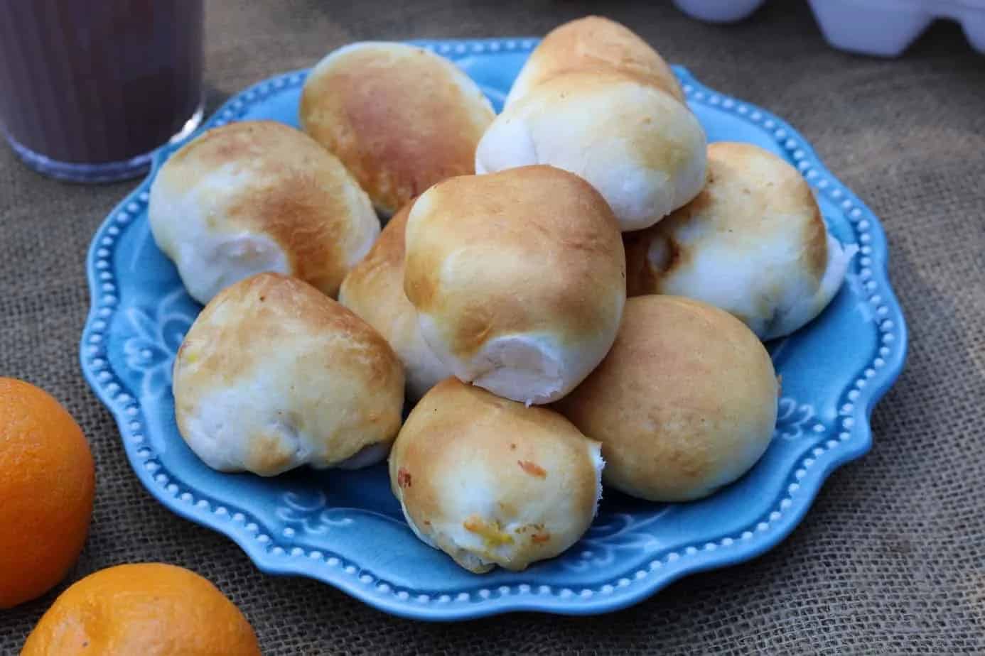 A blue plate holds biscuit bombs.