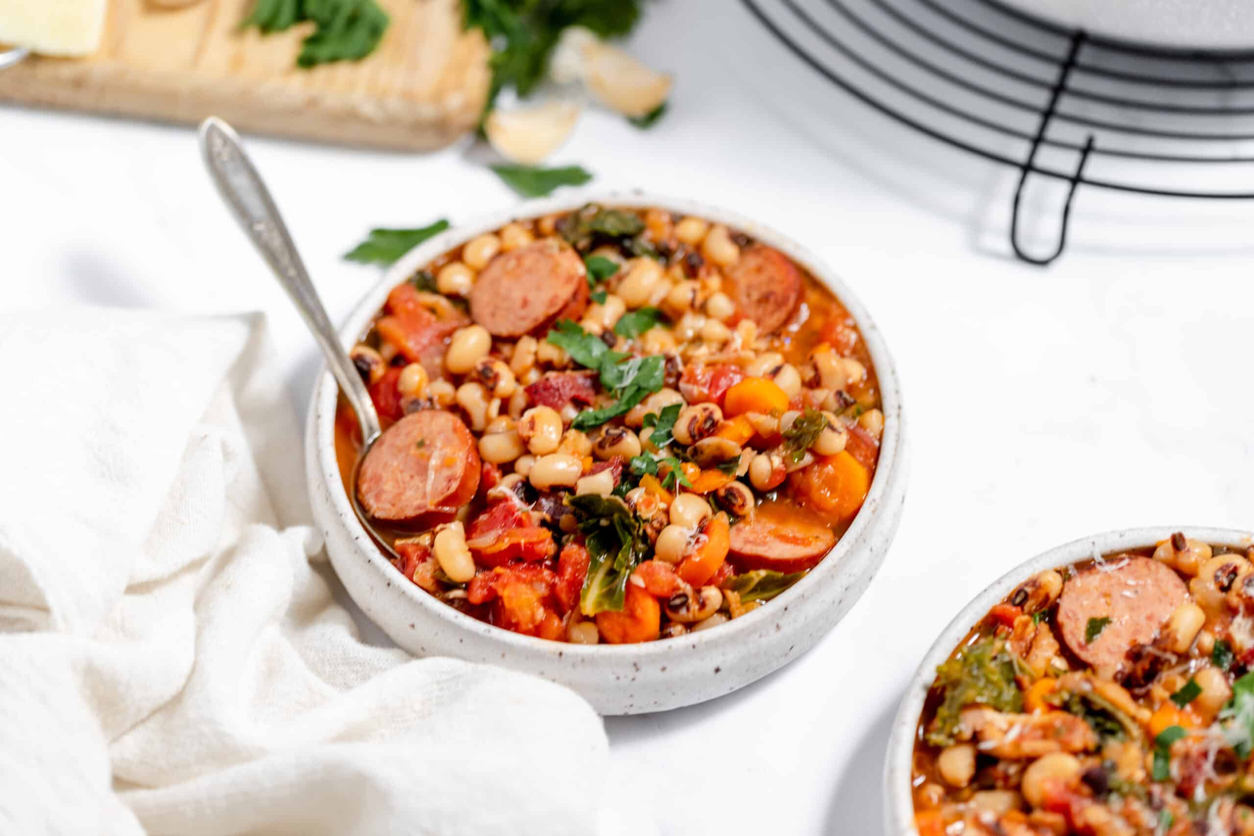 Two bowls of black eyed peas soup.