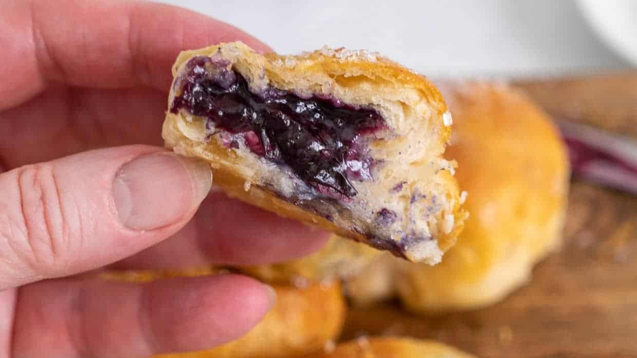 Blueberry pie bomb cut in half to show the filling.