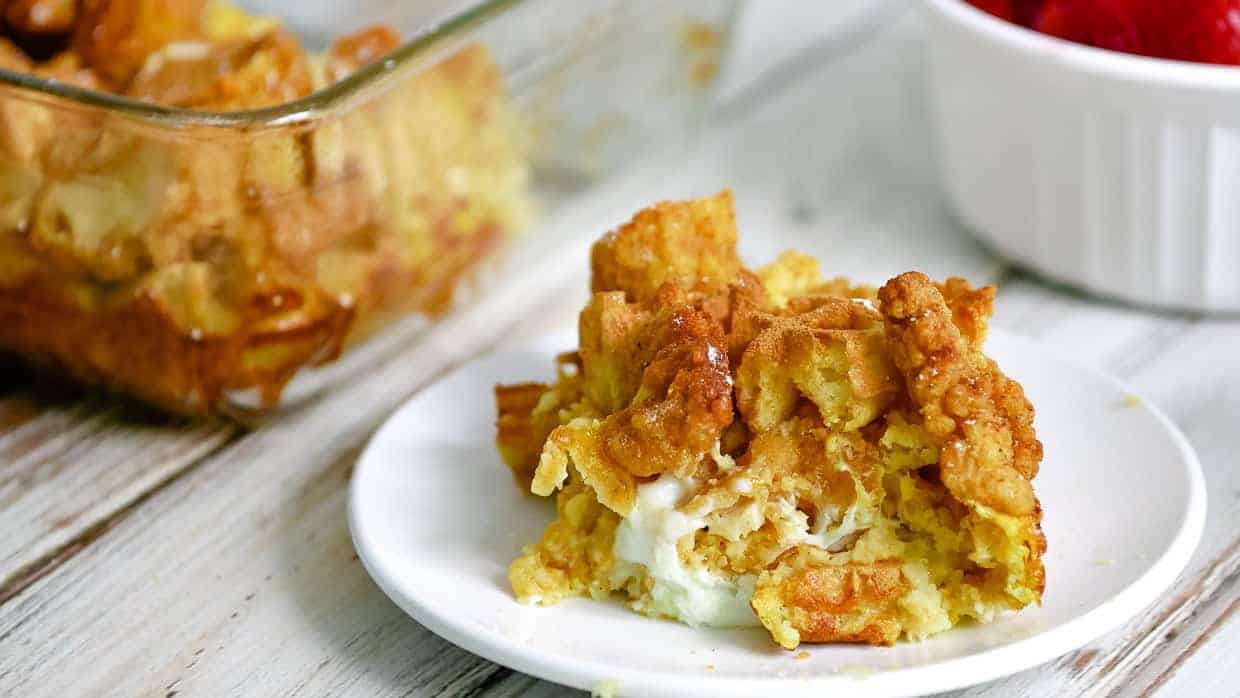 Piece of chicken and waffle casserole on a plate.