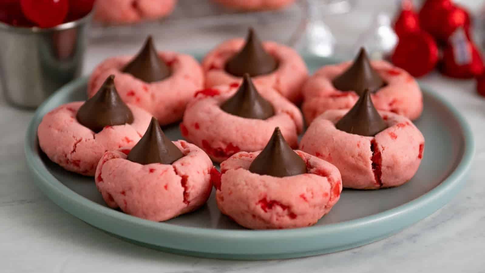 Chocolate cherry blossom cookies on a plate.