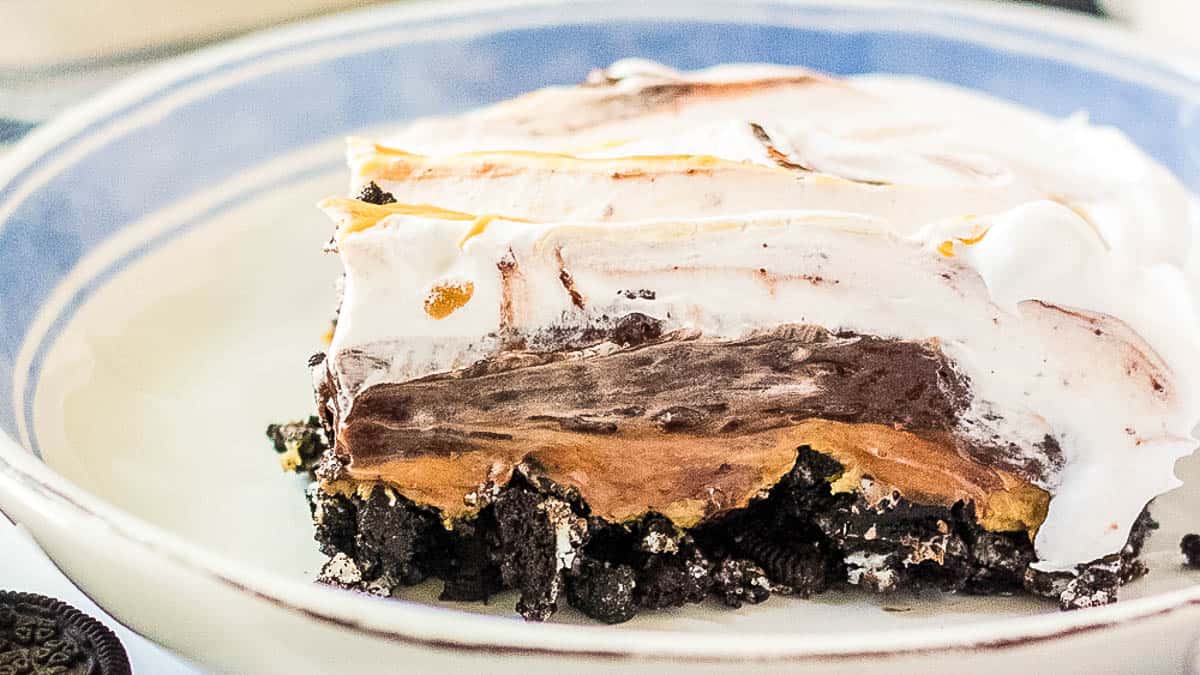 Slice of chocolate peanut butter lasagna on a plate.