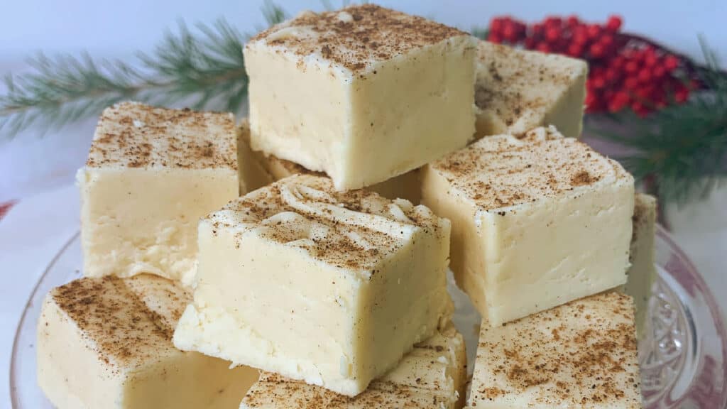 A stack of squares of fudge on a plate.