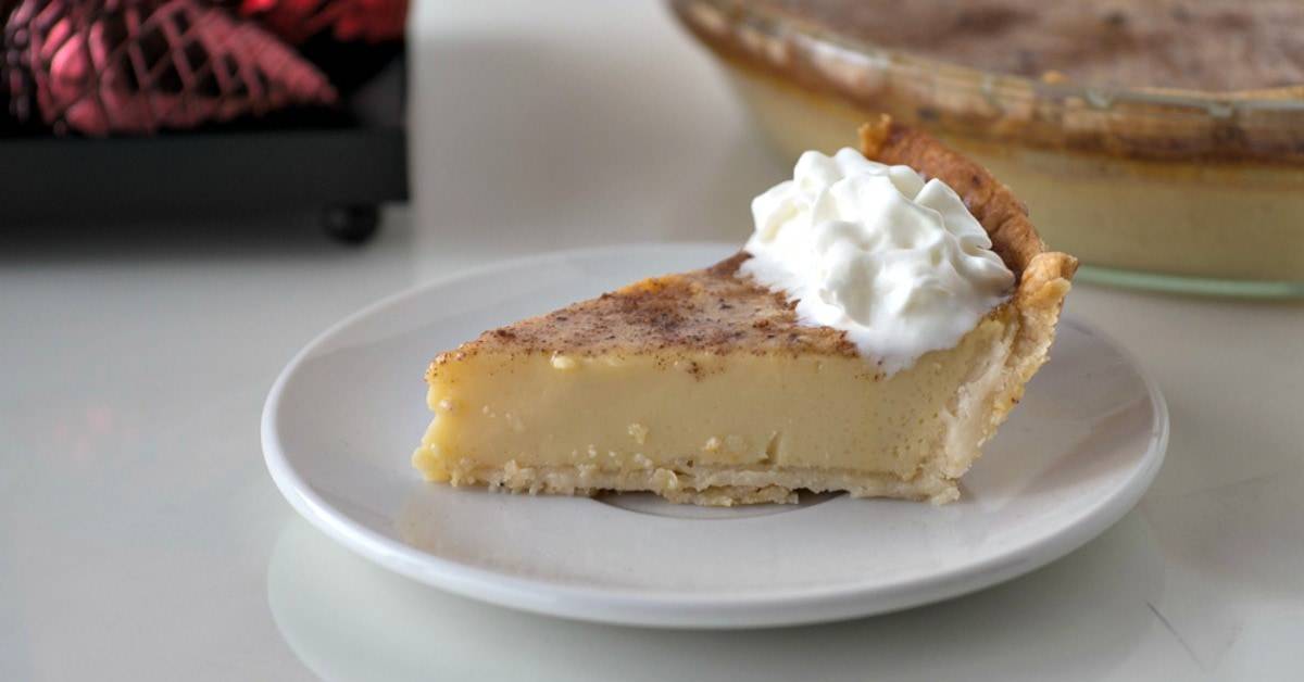 Slice of eggnog pie on a plate.