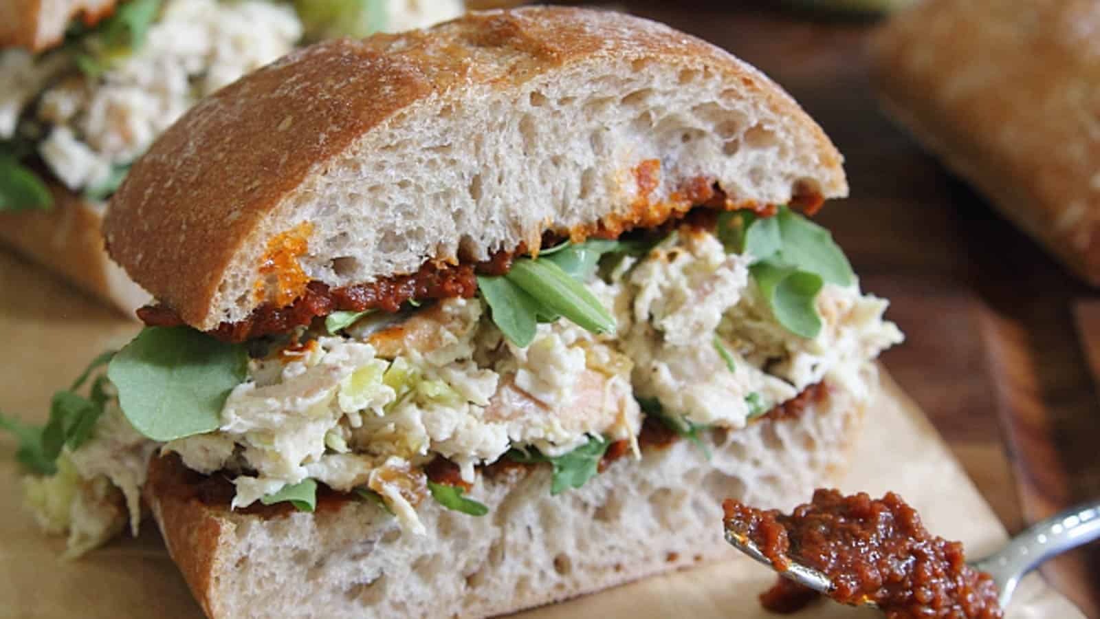 Garlic yogurt chicken salad sandwich with sun dried tomato pesto.