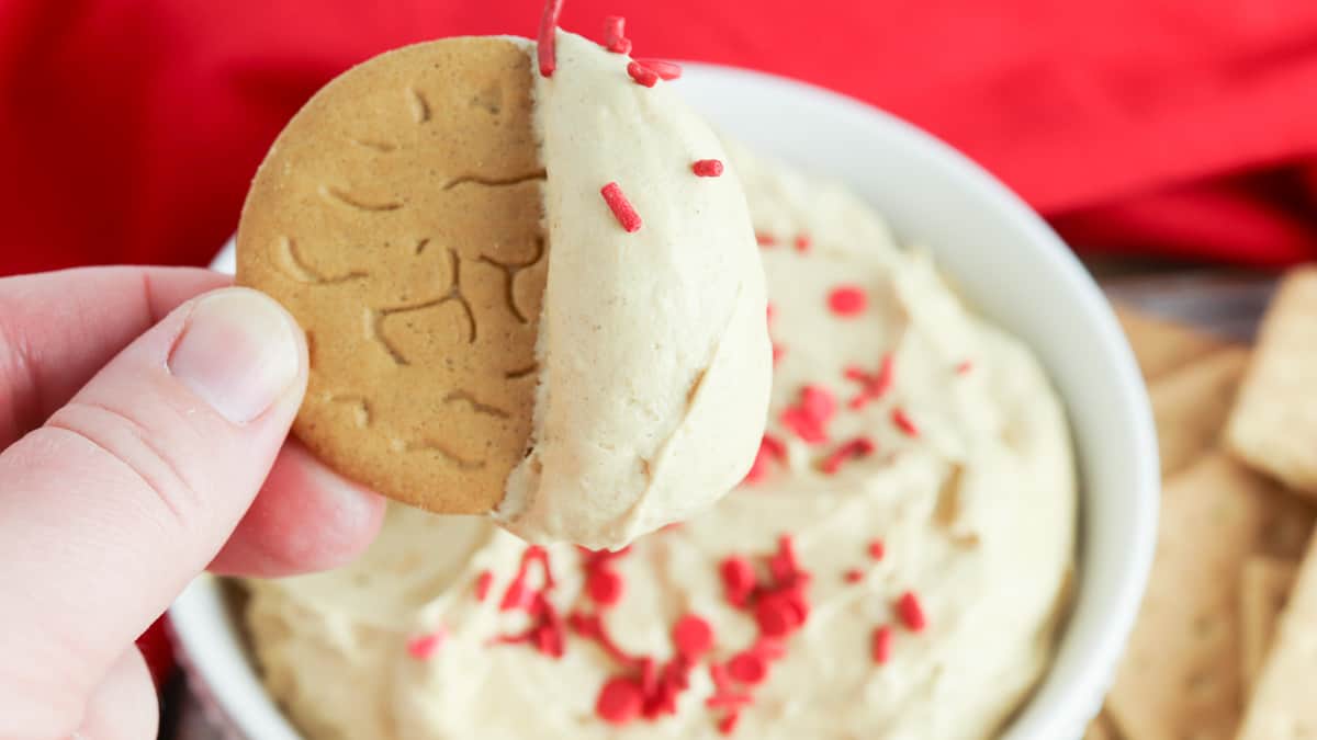 Side view of gingerbread dip with red sprinkles.