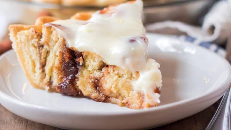 A slice of cinnamon roll pie on a plate.