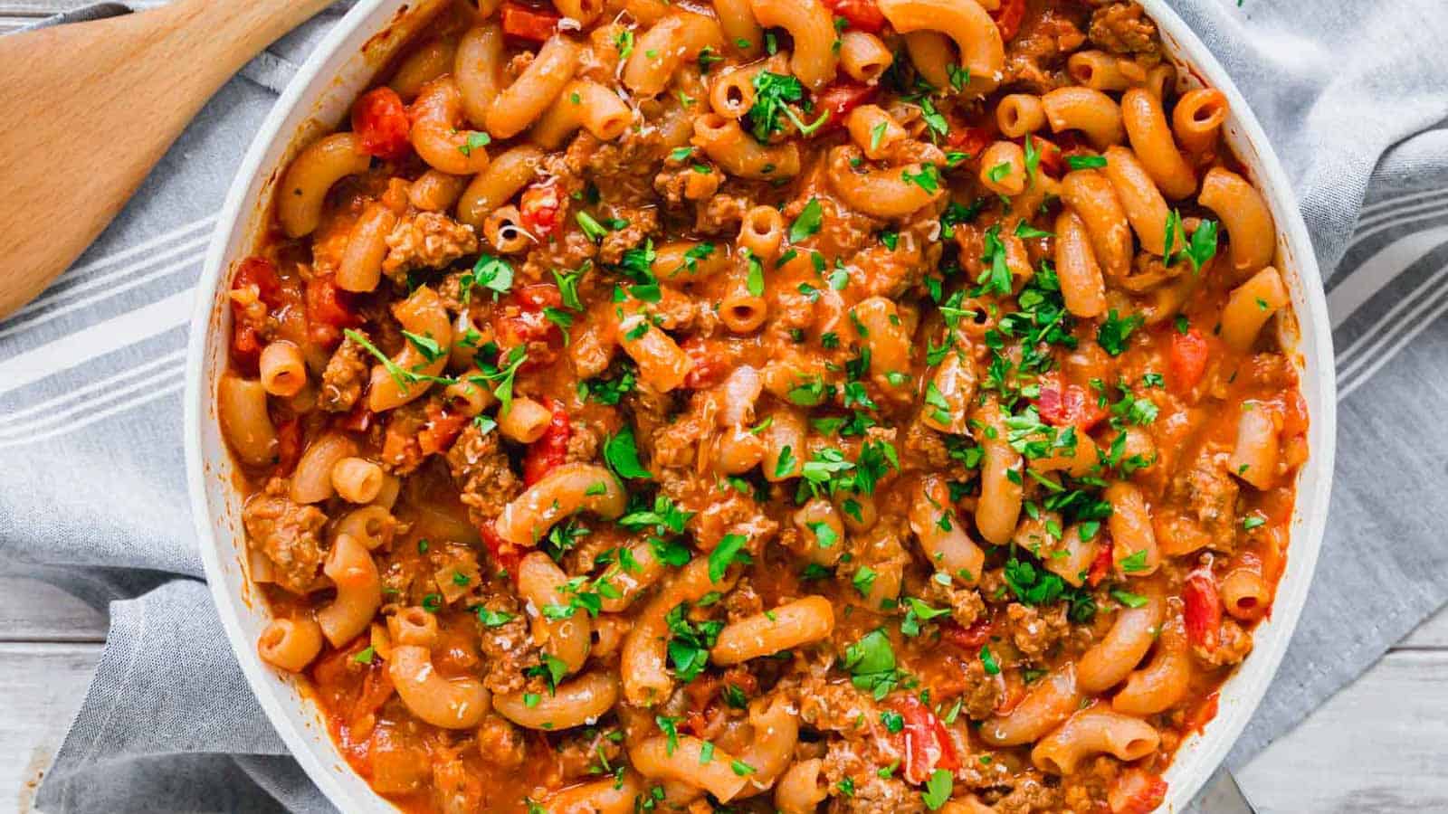 Ground beef pasta skillet garnished with parsley.