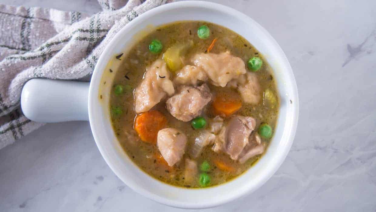 Top view of Instant Pot Chicken and Dumplings in a white bowl.