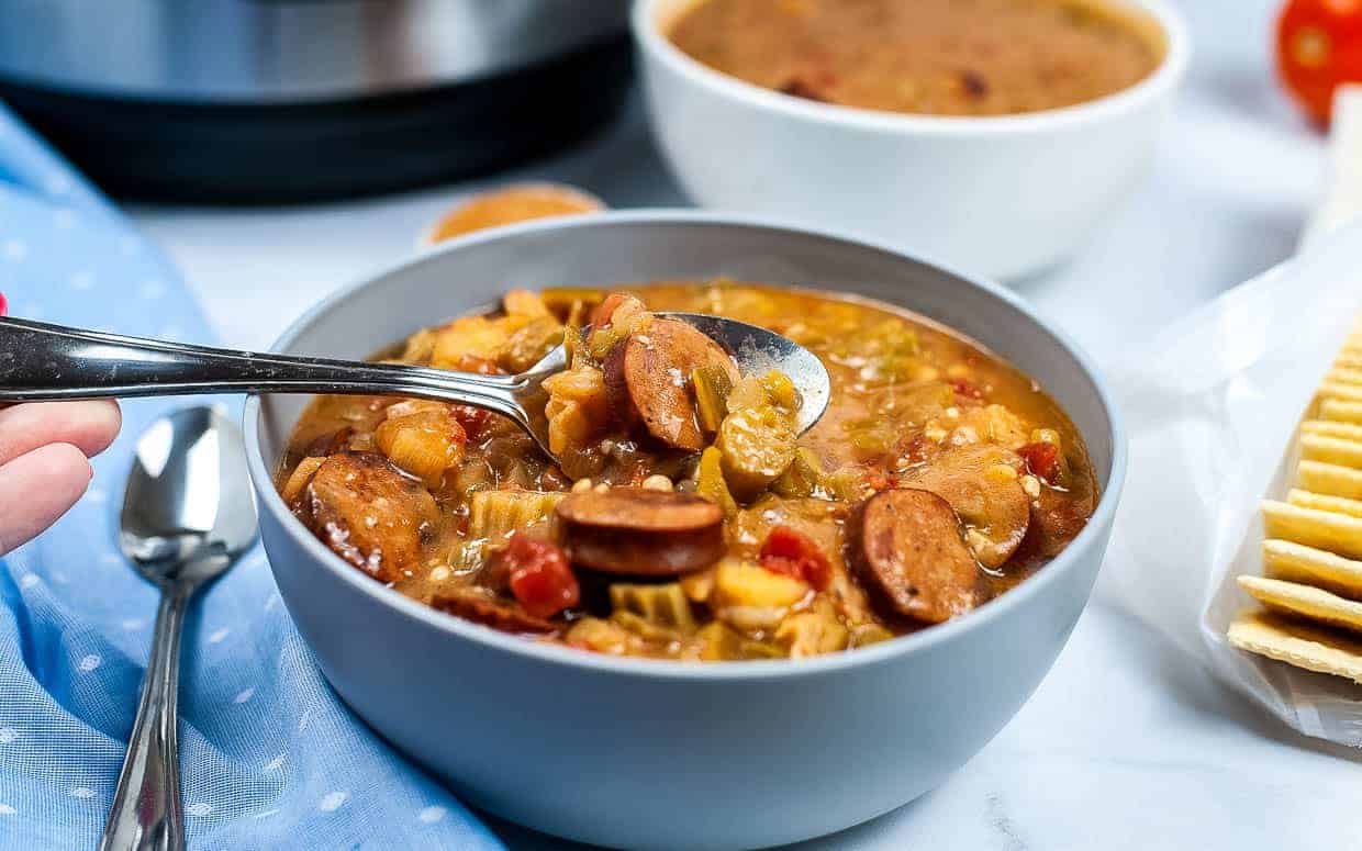 Bowl of gumbo with sausage and okra.