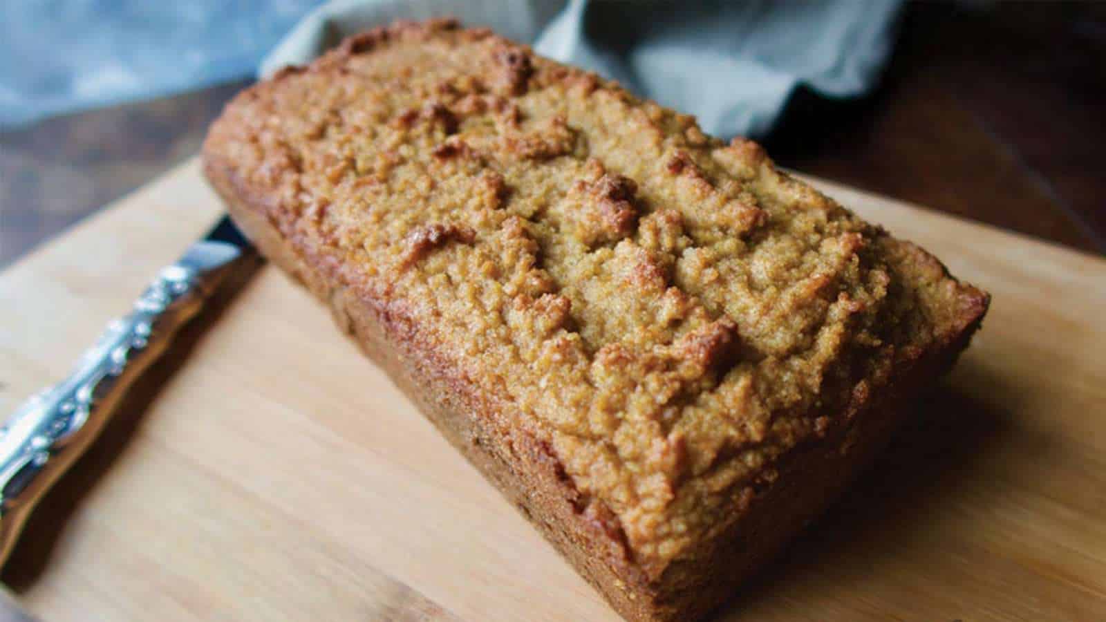 Ketogenic gingerbread on wooden cutting board with knife.